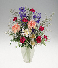 A frosted vase of mixed flowers