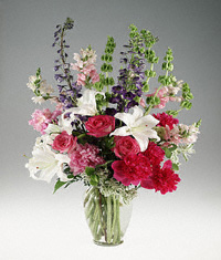 Mixed garden flowers in a clear vase