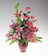 Vase arrangement of pink and lavender flowers