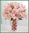 She's loved you unconditionally and made you feel like a standout since day one. Let Mom feel exceptional too with a bouquet of truly stunning elegance. Gorgeous lilies and pink roses hover like stars over a pink handcut glass vase. It's a fitting way to celebrate a special Mom.