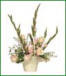 A pink and white arrangement of roses, gladiolus and monte cassino in a white basket.