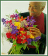 An informal hand-tied bouquet of mixed flowers for a friend.