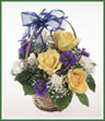 A sweet little basket arrangement for the new baby boy of yellow roses, cornflower, miniature carnations and gypsophila.