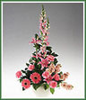 Snapdragons, lilies, gerbera, stock, and carnations in all pink tones.