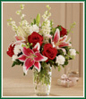 Present this classic and lustrous bouquet to the love of your life and celebrate your anniversary in style! Sweet-fragranced Stargazer lilies and classic red roses are interwoven with pure white blossoms in a dazzling cut-glass vase. She'll fall in love all over again!