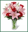 The Anniversary Bouquet is a gorgeous way to celebrate your sweet affection for the love of your life on your special day. Showcasing rich red roses, brilliant pink Asiatic lilies, pale pink stock and a variety of lush greens, this beautiful bouquet is presented in a clear t glass vase for a classic look of sophistication and elegance.