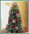 Nothing signifies the start of the holiday season better than a Christmas tree. Place this live boxwood tree on a buffet, end table, or even a dresser for instant holiday cheer. Bedecked with pinecones and ornaments, this diminutive tree will brighten any room.