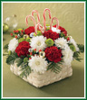 This is it! The Christmas bouquet that everyone on your list will enjoy - because it's fun! All the colors - red carnations, white cushion pompons and green button pompons. All the glitter - gold glass balls and silver glass balls. All the whimsy - five candy canes. All arranged in a whitewash basket that's comfy anywhere. (Don't forget one for yourself!) Style of basket may vary.