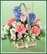 Send the Joys of Spring in this sweet birch bark basket. Fragrant bright blue hyacinth, pastel pink tulips, carnations and white alstroemeria share this handled basket trimmed with a green satin bow. Like sending a pretty Spring garden. Style of basket may vary.