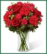 The Always True Bouquet blossoms with love's tender message. Rich red roses and carnations are accented with fuchsia mini carnations and lush greens arranged to perfection in a classic clear glass vase to create an exceptional way to convey your heart's most intimate wishes. 