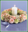 Soft pink spray roses and pastel green carnations form a ring with white alstroemeria and soothing pink and green hydrangea. Complete with a 3