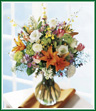 All of our favorite flowers from the garden are in this gorgeous bouquet. Arranged in a glass vase, the bouquet contains orange lilies, pink tulips, white roses, yellow orchids, purple freesia and more. An impressive gift for any occasion. Style of vase may vary.