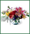 You'll be stargazing with this garden full of flowers. Heaven's best lilies, roses, freesia and other blooms are artfully arranged in a glass bowl.