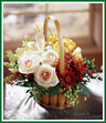 Put a pastel spin on autumn with this bouquet of peach roses, peach Gerbera daisies, yellow roses, and white lilies. Fall berries and maroon pompons add great fall color. Arrangement arrives in a handled bamboo basket. Style of basket may vary.