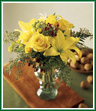 Think happy thoughts and send your best wishes along with this lighthearted bouquet. Sunny yellow lilies, yellow roses and yellow button pompons are accented by red hypericum berries and seeded eucalyptus. A carefree bouquet to brighten their day! Style of vase may vary.
