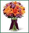 The Harvest Heartstrings Bouquet is a fresh burst of color and autumn light that will surround your special recipient with beauty. Exquisite Cherry Brandy Roses are brought together with purple Peruvian Lilies, orange Asiatic Lilies and burgundy mini carnations accented with lush greens and arranged in a classic clear glass vase. Highlighted by a deep eggplant satin ribbon tied around the neck of the vase, this bouquet is an arrangement that speaks to the heart of the fall season. 