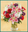 A sweet bouquet - and sweetly scented, too! Stargazer lilies, white stock and red roses offer a lovely fragrance as well as a lovely look. Purple Matsumoto asters and daisy-like monte casino are a perfect complement to this bouquet arranged in a clear glass vase.